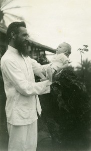 Missionary with a child, in Gabon