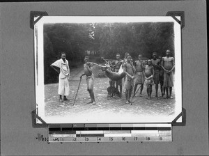 Africans bring in a killed antelope, Mbozi, Tanzania