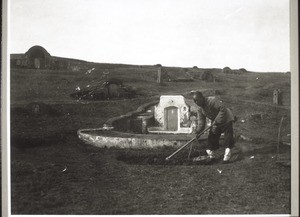 An old chinese man prepairing his grave