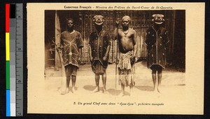 Two masked men flanking a chief and horn bearer, Cameroon, ca.1920-1940