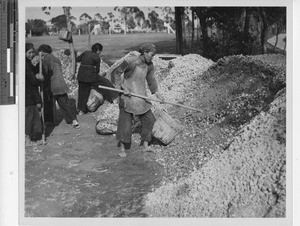 Making a concrete road at Henan, China, 1949