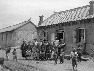 Newly established street chapel. In front of the chapel are some of the christian women as well