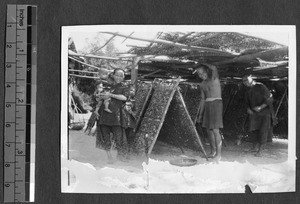 Family displaying silk crop, Guangzhou, Guangdong, China, ca.1930