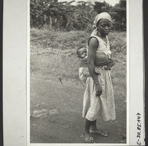 A young mother with her child; from the tribe of the Bafo in Kumba (Duala woman)