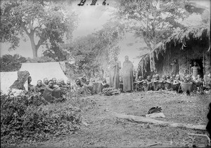 African men in front of a hut and tents, Tanzania, ca.1893-1920