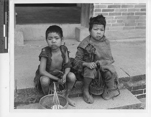 Sick and hungry children at Cenqi, China, 1948