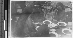 Sisters eating lunch on a junk, Kongmoon, China, ca. 1930