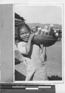 A girl selling sugar cane in Hong Kong, China, 1947