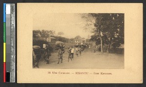 Caravan walking through town, Kisantu, Congo, ca.1920-1940