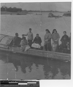 Maryknoll Sisters on a boat with the Chinese in Luoding, China, 1925