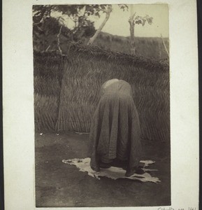 Hausa priest in Winnebah bending down to pray