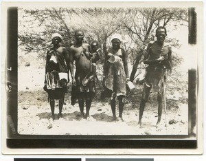 African travelers in front of a thornbush, South Africa