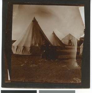 Missionary W. Schulenburg in front of a tent in the camp near Mafikeng, South Africa, ca.1901-1903