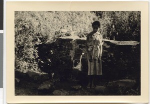 Young girl at the fountain, Ayra, Ethiopia