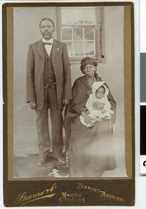 Church warden Jakob Mathole with wife and child, South Africa