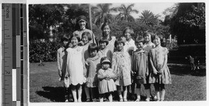 Sister Veronica Hartman, MM, standing with Japanese girls, Punahou, Honolulu, Hawaii, 1928