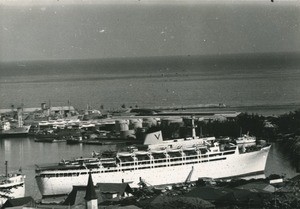 Port of Papeete with a liner. Behind, the French Navy's naval bases