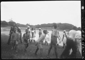 African boys and girls performing a show, Nwapulane, Mozambique, 1933