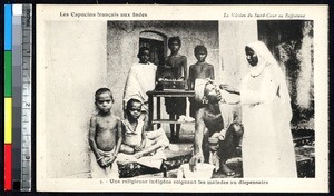 Native Sister caring for children at a dispensary, Rajasthan, India, ca.1920-1940