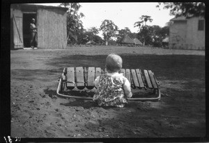 Baby playing the xylophone, Manjacaze, Mozambique