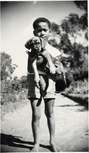 Young Malagasy and his dog, in Madagascar