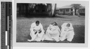 Three babies sitting outdoors at the Maui Children's Home, Wailuku, Hawaii, 1941