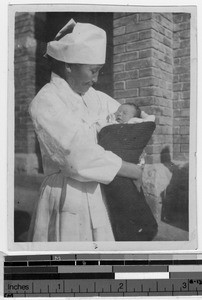 Korean woman holding an infant, Korea, 1933