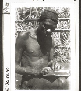 A christian from Babungo with leprosy reads his Bible