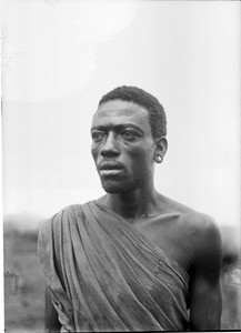 African man with stretched earlobe, Tanzania, ca.1893-1920