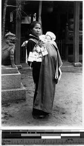 Japanese woman holding an infant, Japan, ca. 1910-1930