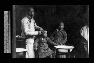 Village barber, China, ca.1921