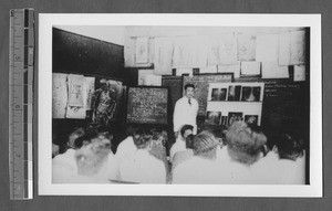 Students diagnosing patient, Jinan, Shandong, China, ca.1940