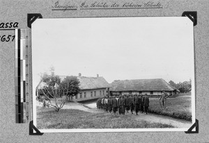 Missionary Gemuseus with students, Rungwe, Tanzania, ca. 1907-1916