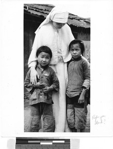 Maryknoll Sister with two young children, NgFa, Kaying, China, ca.1940