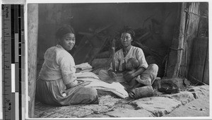 Ironing clothes with clubs, Peng Yang, Korea, ca. 1920-1940