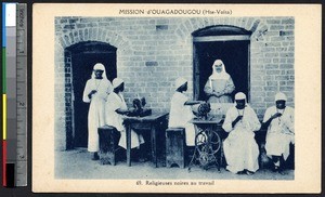 Indigenous sisters sewing near a brick house, Ouagadougou, Burkina Faso, ca.1900-1930