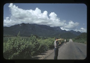 boy and woman, mountains in the background