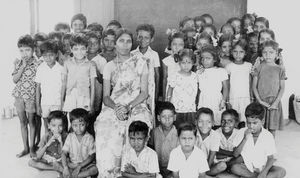 South Arcot District, India. Grade 2 children at the Neyveli School with their teacher, Mrs Sel