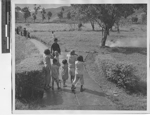 Children enjoying firecrackers at Jiangmen, China, 1947