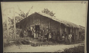 "Deutsche Reichsschule in Kamerun mit Lehrer Christaller. Oct. 1887. Gesetzl. geschützt. W. M.fr