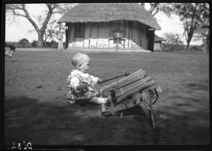 Baby playing the xylophone, Manjacaze, Mozambique