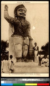 Indigenous people around a statue of Ayampalayam, Madura, India, ca.1920-1940