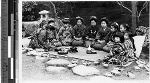 Eleven girls sitting in a group, Japan, ca. 1920-1940