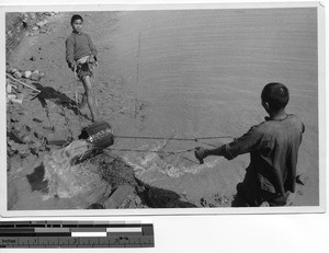 Two young men working at Dongzhen, China, 1937