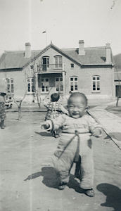 A happy boy. Karen Gormsen's Orphanage in the background