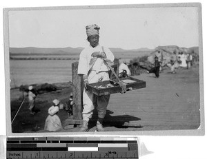 Woman selling cakes, Korea, ca. 1920-1940