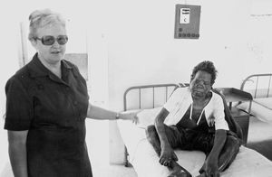 Missionary and Head Nurse, Helga Johansen with a patient at Vadathorasalur Leprosy Hospital, Ar