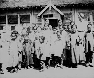 Chinese schoolchildren with a Danish Woman missionary