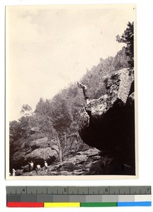 Man diving off a cliff, China, ca.1913-1923