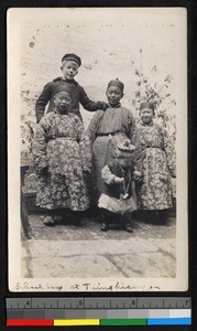 Schoolboys standing outside a building, Qingjiang, Jiangsu, China, ca.1905